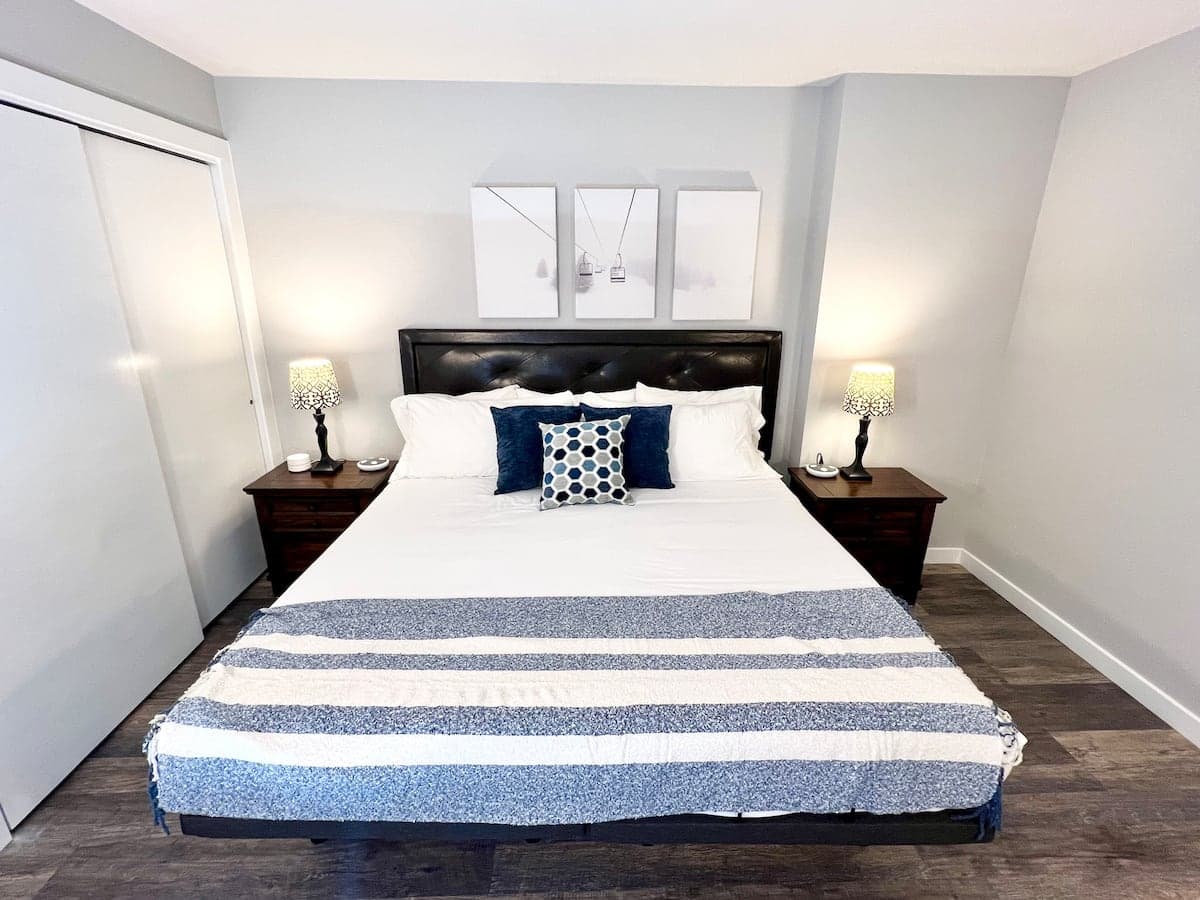 Bedroom 1 (main floor) with king bed and sectional couch