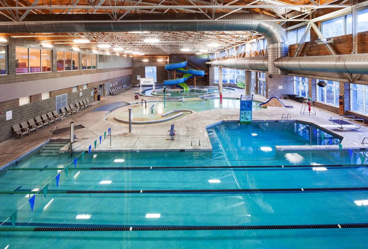 Full indoor aquatic center with pools and a waterslide