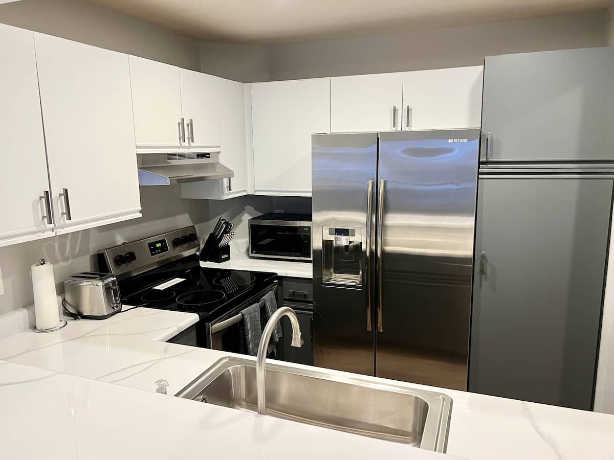 Kitchen with peninsula seating and dining area