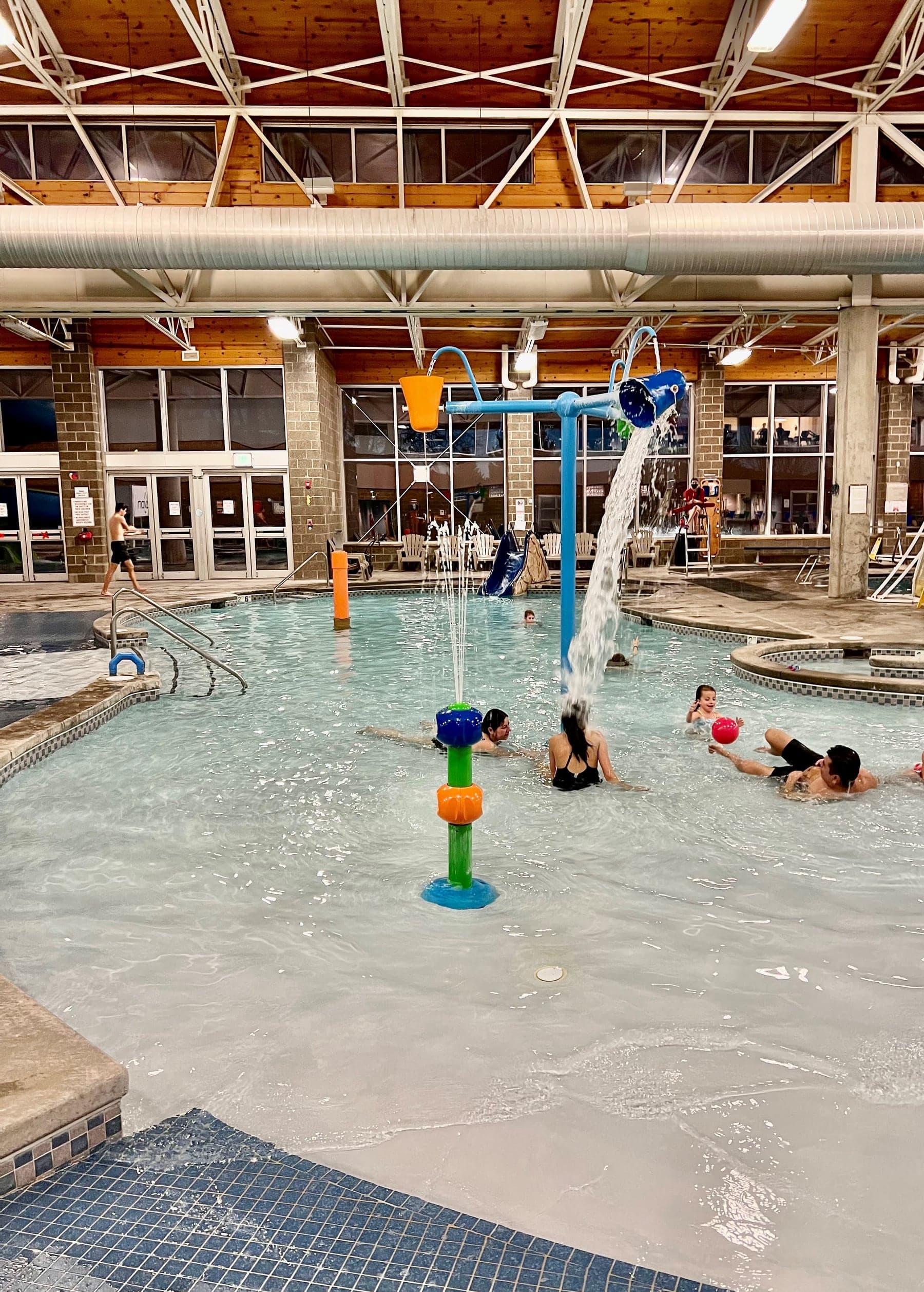Interactive splash pool with fountains and a tipping bucket