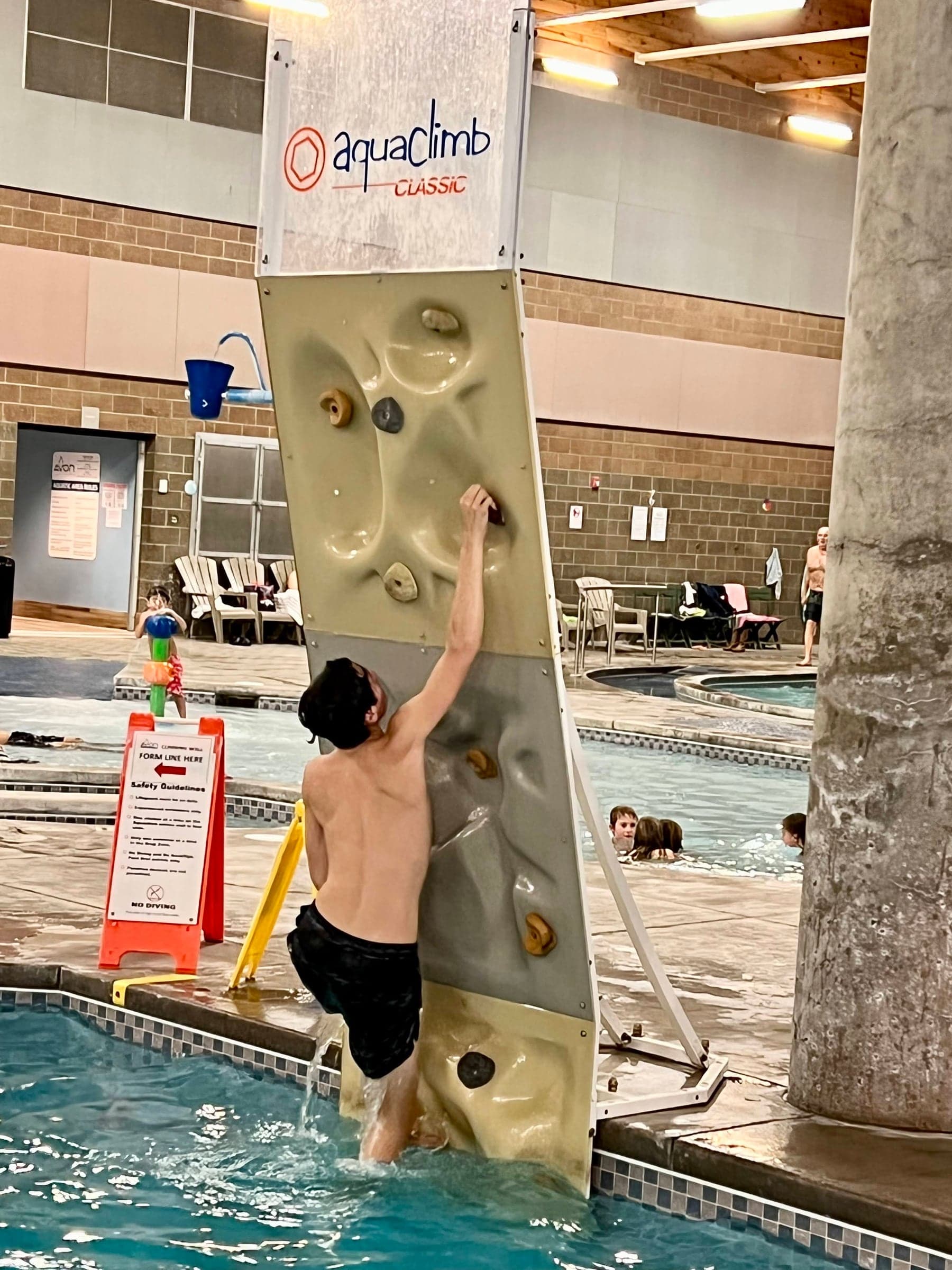 Aquatic climbing wall beside the indoor pool
